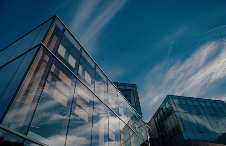 Low angle of glass buildings.png