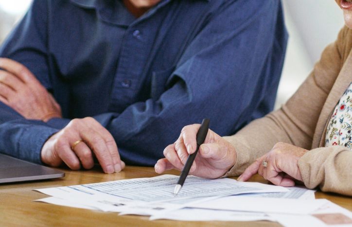 Two People Checking Documents