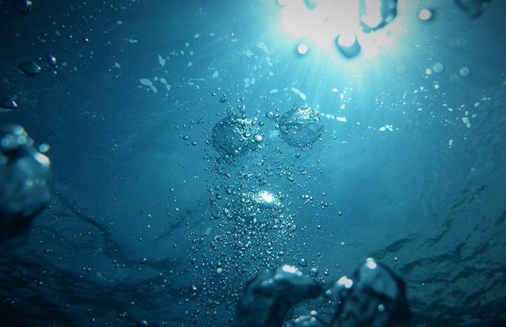 Air Bubbles Floating To The Surface In Water