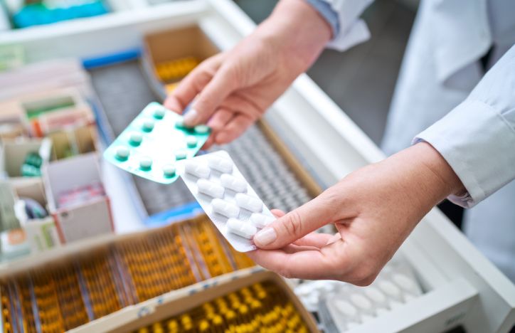 Pharmacist Holding Medicines