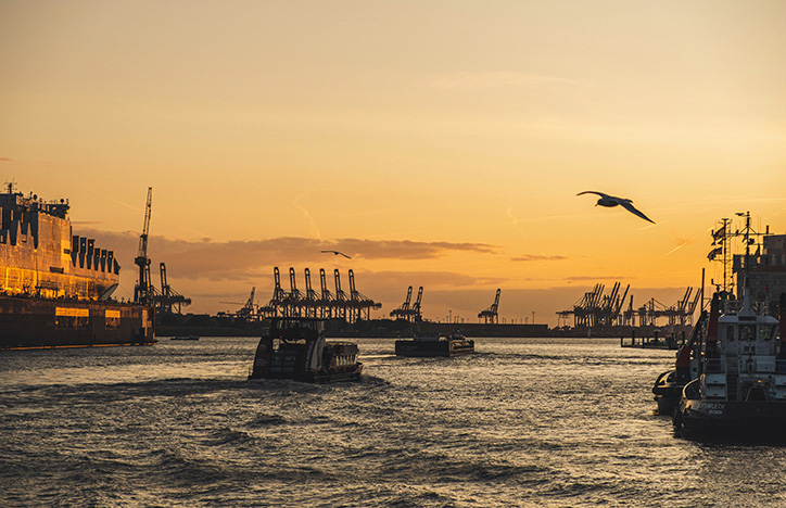 Boats In A Harbour Against A Sunset