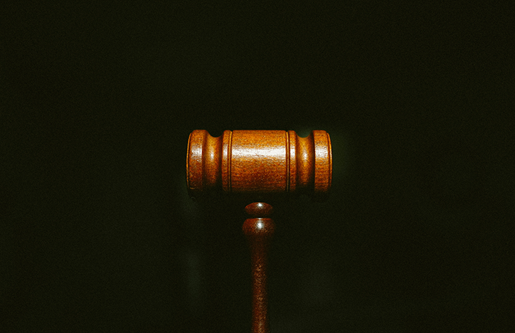 Judge's Hammer Against A Black Background