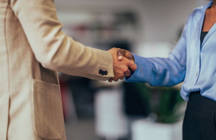 Two People Shaking Hands