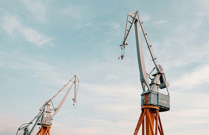 Two cranes against a blue sky.jpg