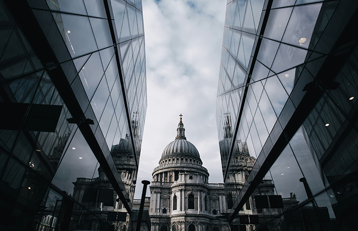 St Pauls Cathedral next to glass buildings.jpg
